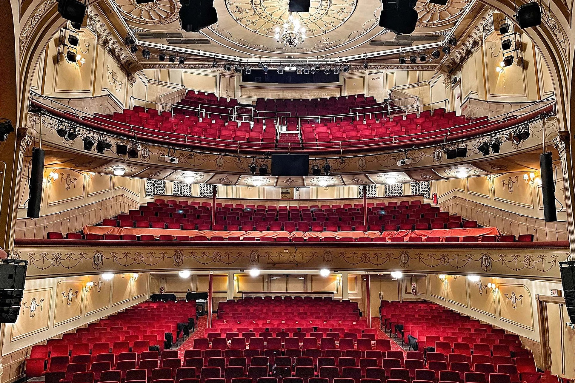The empty red-velvet auditorium of the Athenaeum Theatre seen from the stage